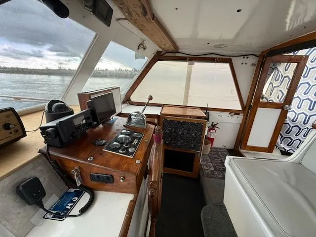 Slide: The Image of Interior of 1982 Rough Water 41 Pilothouse with controls and navigation equipment. - 17