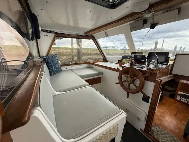 Slide: The Image of Interior of 1982 Rough Water 41 Pilothouse with seating area. - 21