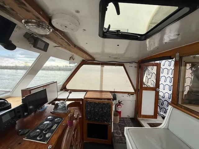 Slide: The Image of Engine of a 1982 Rough Water 41 Pilothouse, painted blue. - 24