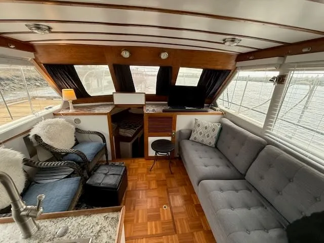 Slide: The Image of Interior of a 1982 Rough Water 41 Pilothouse yacht with cozy furnishings. - 3