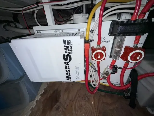 Slide: The Image of Rough Water 41 Pilothouse 1982 with solar panels and Garmin equipment in harbor. - 32