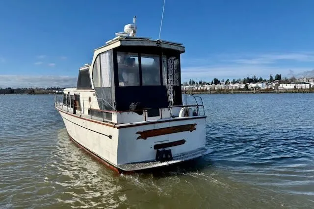 Slide: The Image of 1982 Rough Water 41 Pilothouse boat on calm water. - 35