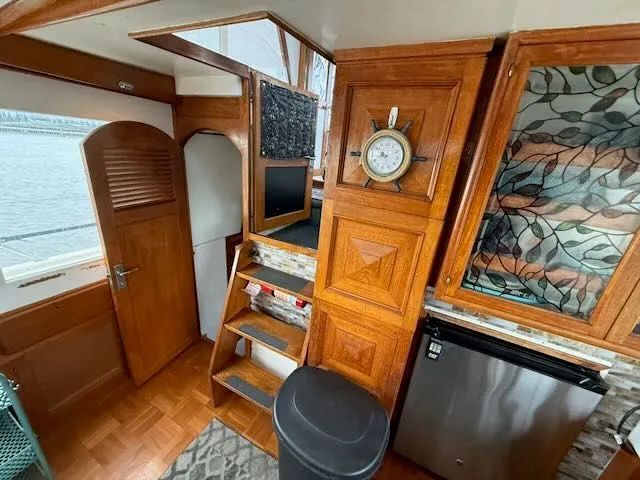 Slide: The Image of Interior of a 1982 Rough Water 41 Pilothouse yacht with wooden decor. - 4