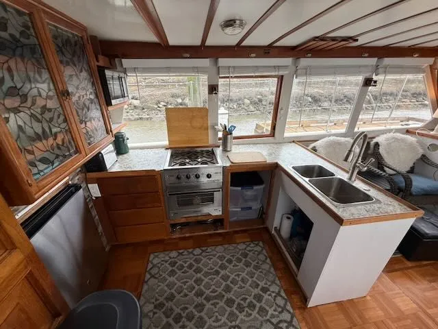 Slide: The Image of Interior of 1982 Rough Water 41 Pilothouse yacht with kitchen. - 8