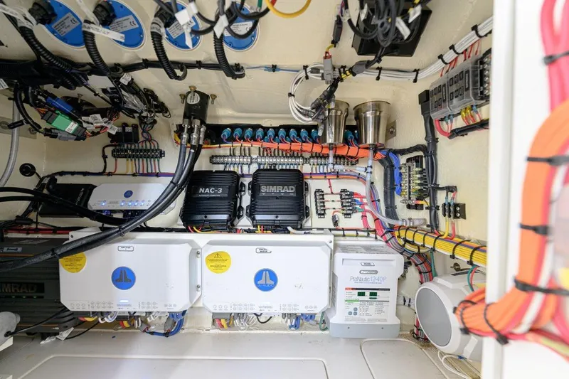 Slide: The Image of Electrical system of 2024 SeaVee 370Z boat, featuring Simrad equipment and organized wiring. - 18
