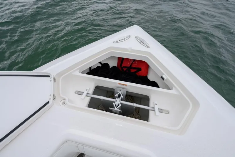 Slide: The Image of 2024 SeaVee 370Z boat anchor compartment with ropes and safety equipment. - 20