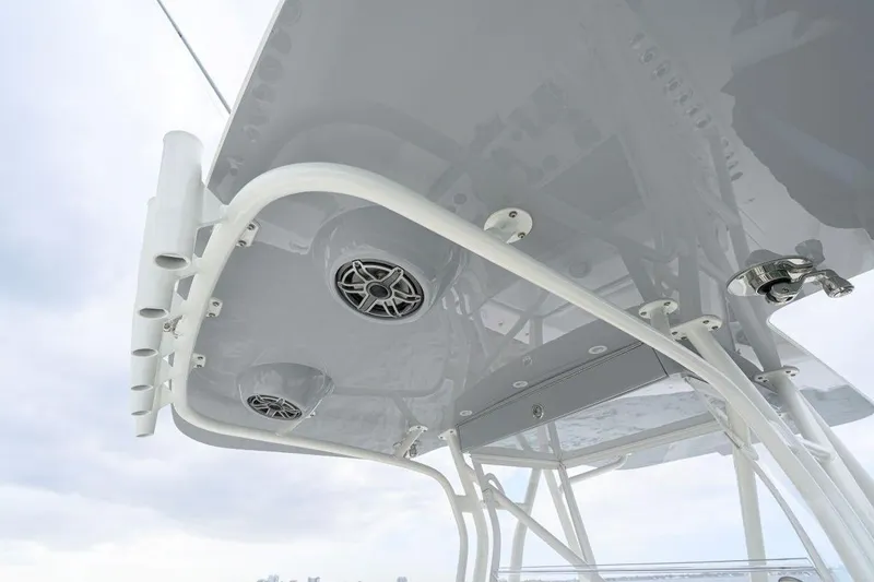 Slide: The Image of 2024 SeaVee 370Z boat's overhead view with speakers and rod holders. - 27