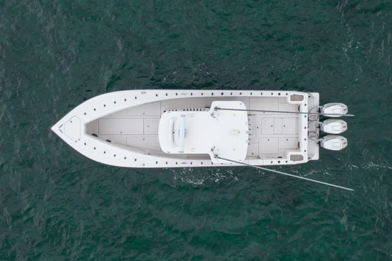 Slide: The Image of Overhead view of 2024 SeaVee 370Z boat on water, featuring triple outboard engines. - 5
