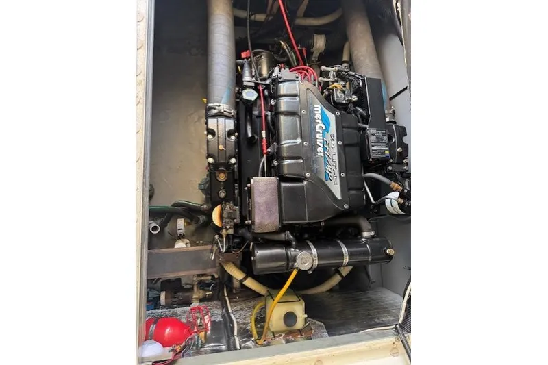 Slide: The Image of 1996 Sea Ray 400 Sedan Bridge bathroom with shower, toilet, and sink. - 11