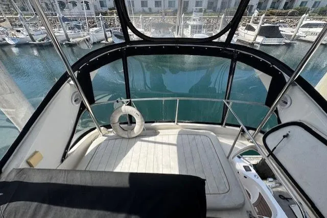 Slide: The Image of Interior view of 1996 Sea Ray 400 Sedan Bridge yacht at marina. - 21