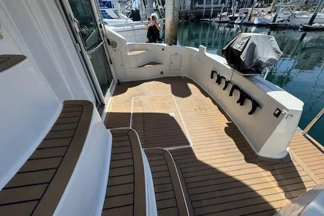 Slide: The Image of Engine compartment of a 1996 Sea Ray 400 Sedan Bridge, featuring a red engine and battery setup. - 33