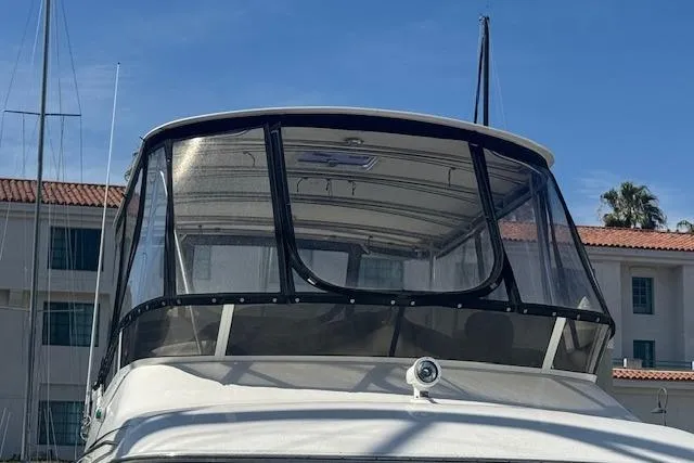 Slide: The Image of 1996 Sea Ray 400 Sedan Bridge swim platform with stainless steel railings at marina. - 39