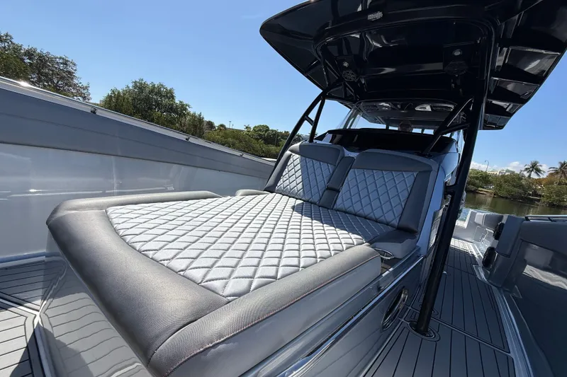 Slide: The Image of 2018 Nor-Tech 390 Sport Center Console with luxurious seating and sleek design. - 23