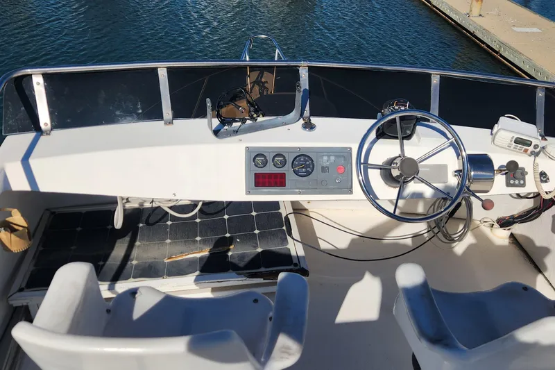 Slide: The Image of Helm of 2001 Eastern 31 Casco Bay boat with steering wheel and control panel. - 15