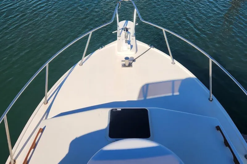 Slide: The Image of Bow view of 2001 Eastern 31 Casco Bay Flybridge on calm water. - 6