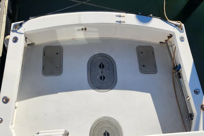 Slide: The Image of 2001 Eastern 31 Casco Bay Flybridge boat deck with storage hatches and clean surface. - 5