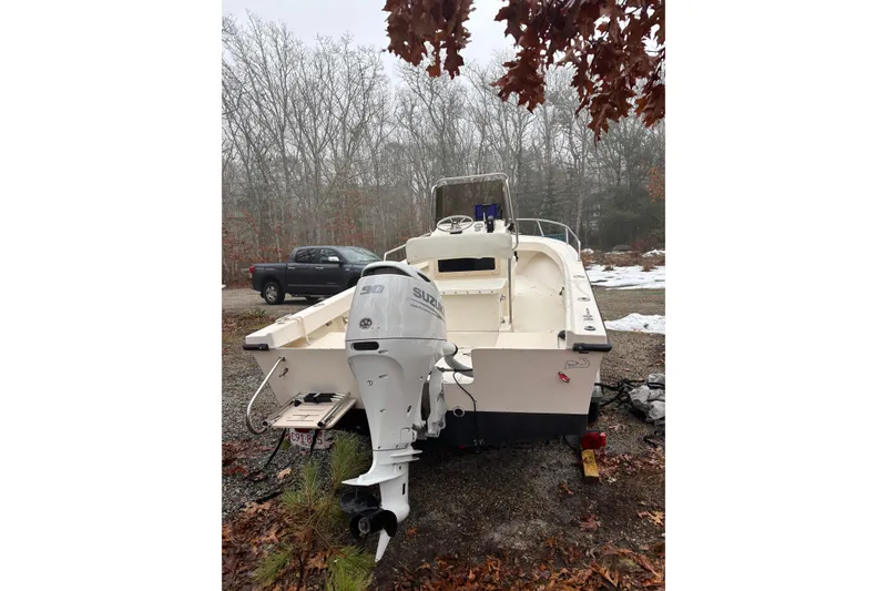 Slide: The Image of 1998 Parker 1801 Center Console boat with Suzuki 90 outboard motor in wooded area. - 9