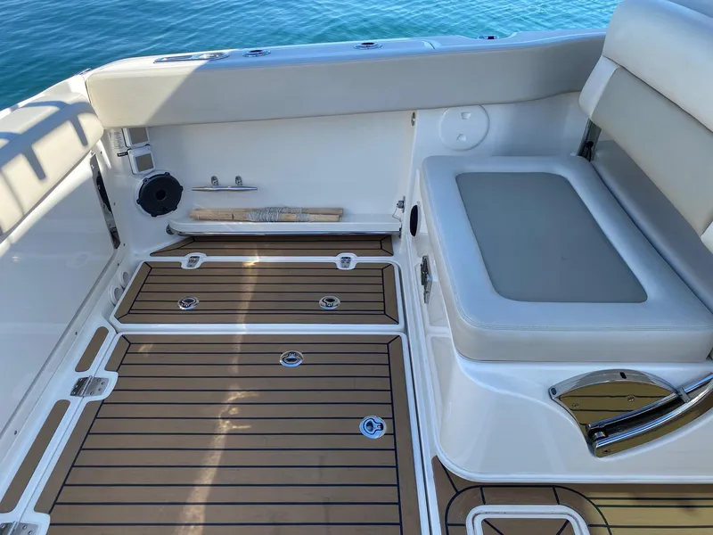 Slide: The Image of Interior of 2019 Boston Whaler 320 Vantage with wood flooring. - 10