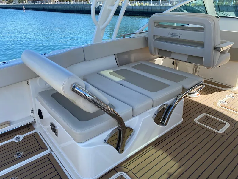 Slide: The Image of Boston Whaler 320 Vantage 2019, luxurious seating on teak deck. - 14