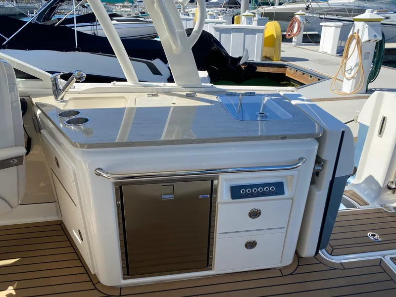 Slide: The Image of Boston Whaler 320 Vantage 2019 with onboard kitchen and refrigerator. - 16