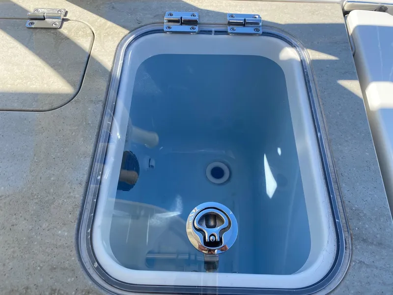 Slide: The Image of Boston Whaler 320 Vantage 2019 livewell with transparent lid. - 17