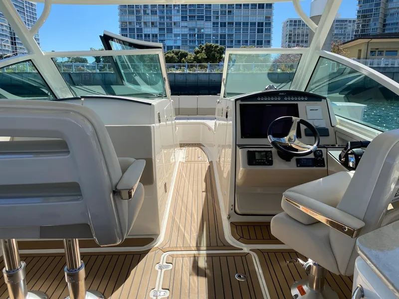 Slide: The Image of Interior of a 2019 Boston Whaler 320 Vantage boat with modern controls. - 18