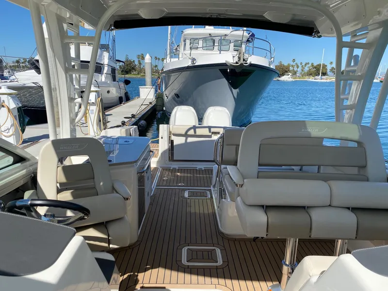 Slide: The Image of Interior view of a 2019 Boston Whaler 320 Vantage boat in harbor. - 19