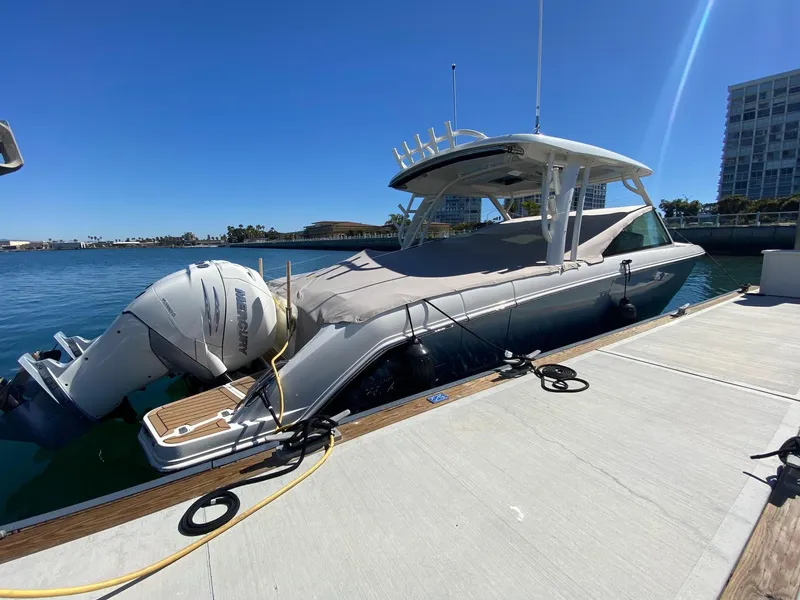 Slide: The Image of Boston Whaler 320 Vantage 2019 at dock, sunny day, calm water. - 2