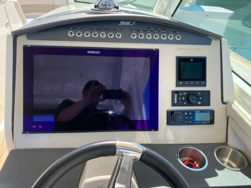 Slide: The Image of Dashboard of a 2019 Boston Whaler 320 Vantage with Simrad display. - 21