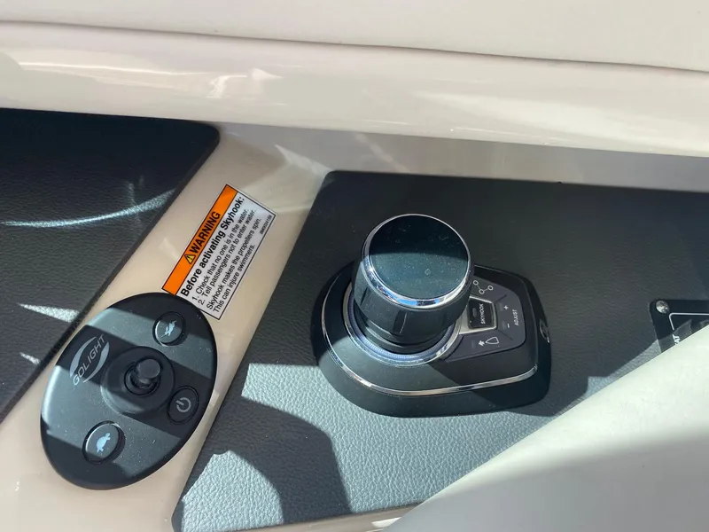 Slide: The Image of Joystick control on a 2019 Boston Whaler 320 Vantage boat. - 22