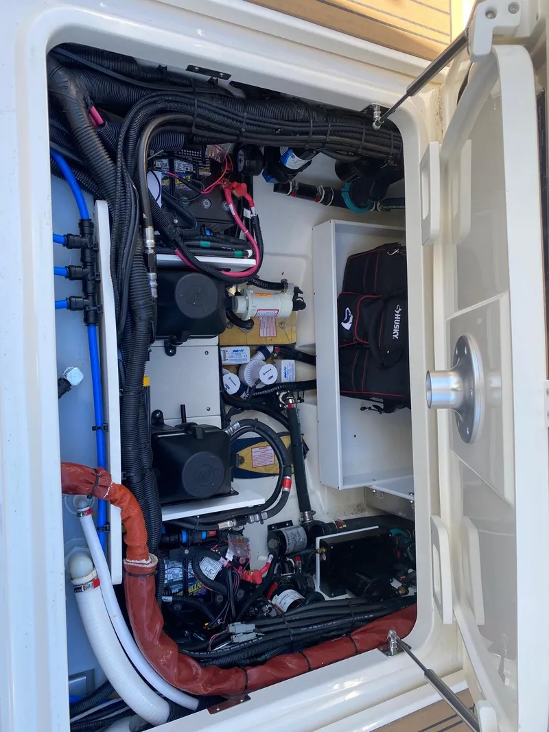 Slide: The Image of Interior view of a 2019 Boston Whaler 320 Vantage engine compartment. - 28