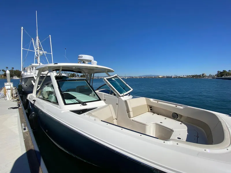 Slide: The Image of 2019 Boston Whaler 320 Vantage docked on a sunny day. - 3