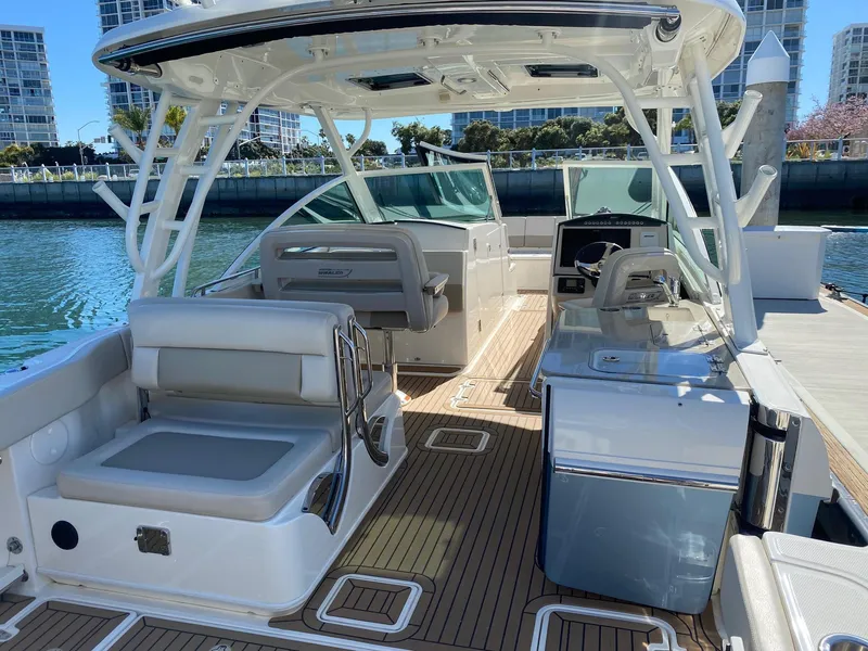 Slide: The Image of Interior view of a 2019 Boston Whaler 320 Vantage boat in harbor. - 8