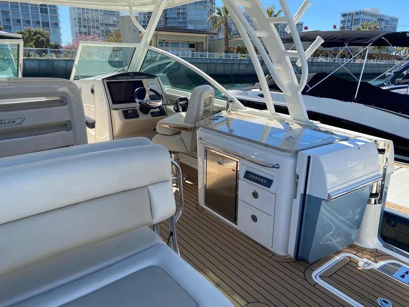 Slide: The Image of Interior of a 2019 Boston Whaler 320 Vantage boat at the marina. - 9