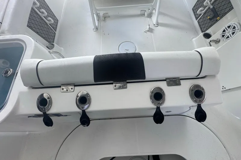 Slide: The Image of 2023 Wellcraft 242 Fisherman boat interior with rod holders and seating. - 22