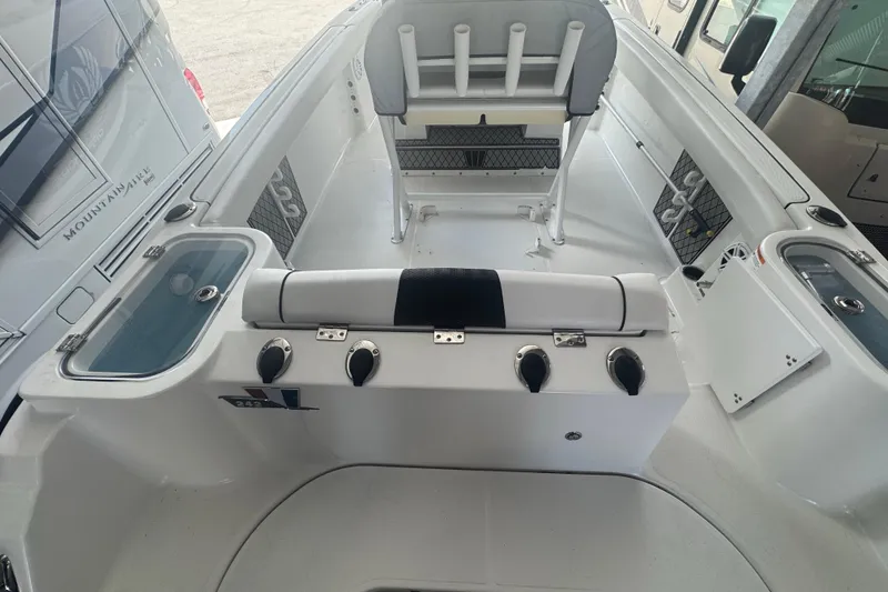 Slide: The Image of 2023 Wellcraft 242 Fisherman boat interior with seating and storage compartments. - 24