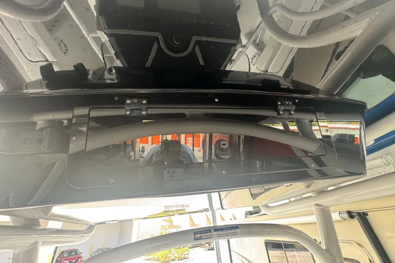 Slide: The Image of 2023 Wellcraft 242 Fisherman boat interior, showcasing overhead storage compartment. - 31