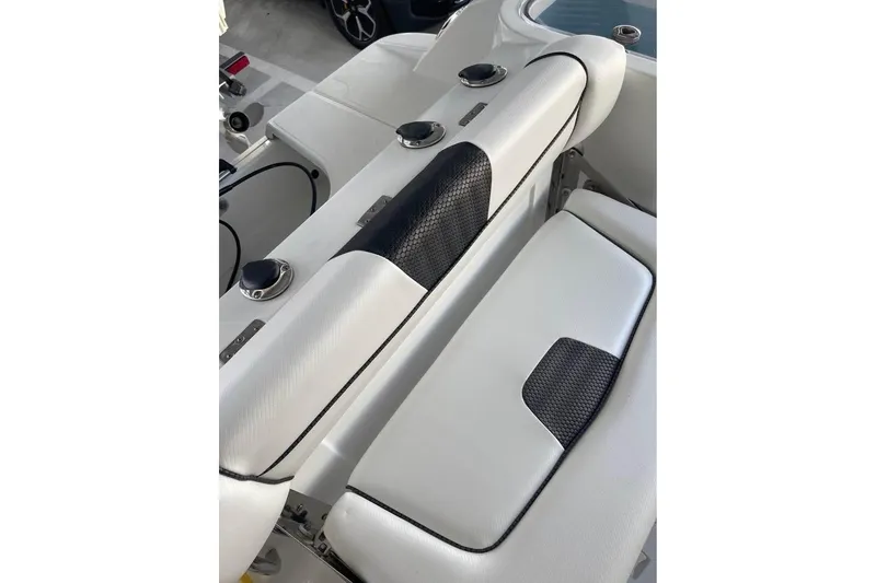 Slide: The Image of 2023 Wellcraft 242 Fisherman boat hull on trailer, showcasing sleek design. - 4