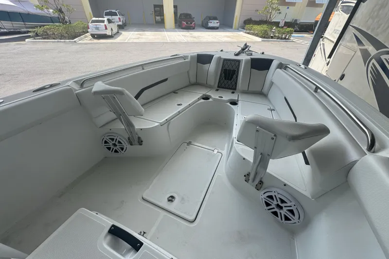 Slide: The Image of 2023 Wellcraft 242 Fisherman boat interior with seating and storage compartments. - 42