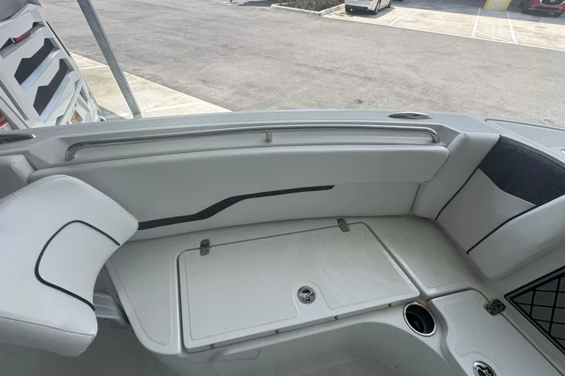 Slide: The Image of 2023 Wellcraft 242 Fisherman boat interior with seating and storage compartments. - 48