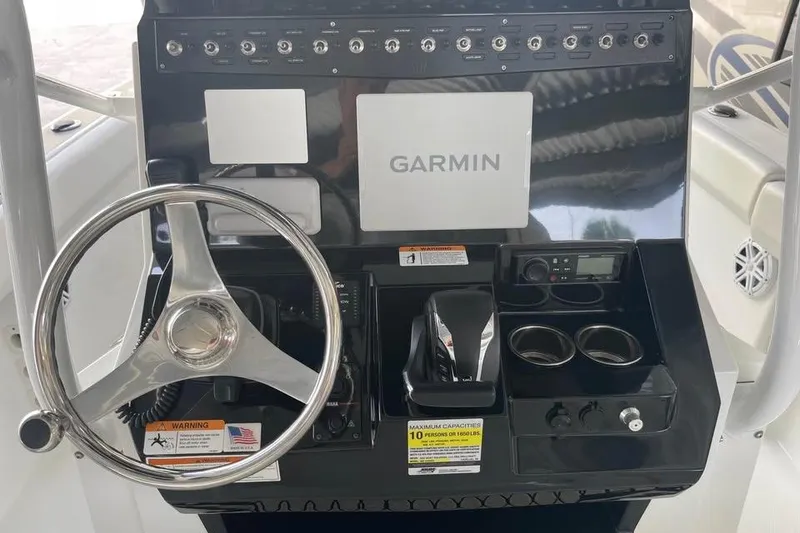 Slide: The Image of 2023 Wellcraft 242 Fisherman boat, featuring sleek design and branding details. - 5