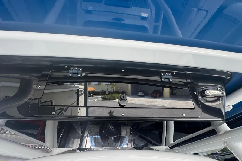 Slide: The Image of 2023 Wellcraft 242 Fisherman boat dashboard with storage compartment and sleek design. - 52