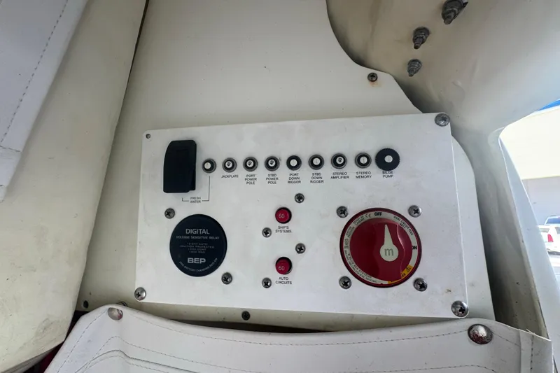 Slide: The Image of Control panel of 2023 Wellcraft 242 Fisherman boat with various switches and dials. - 54