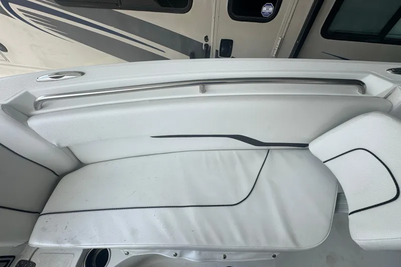 Slide: The Image of 2023 Wellcraft 242 Fisherman boat interior seating with white upholstery and sleek design. - 60