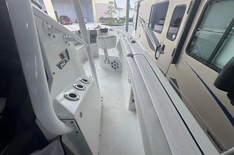 Slide: The Image of 2023 Wellcraft 242 Fisherman boat interior with seating and rod holders. - 67