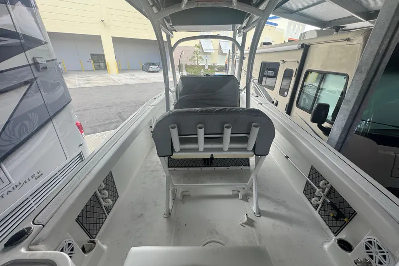 Slide: The Image of 2023 Wellcraft 242 Fisherman boat interior with seating and rod holders. - 68