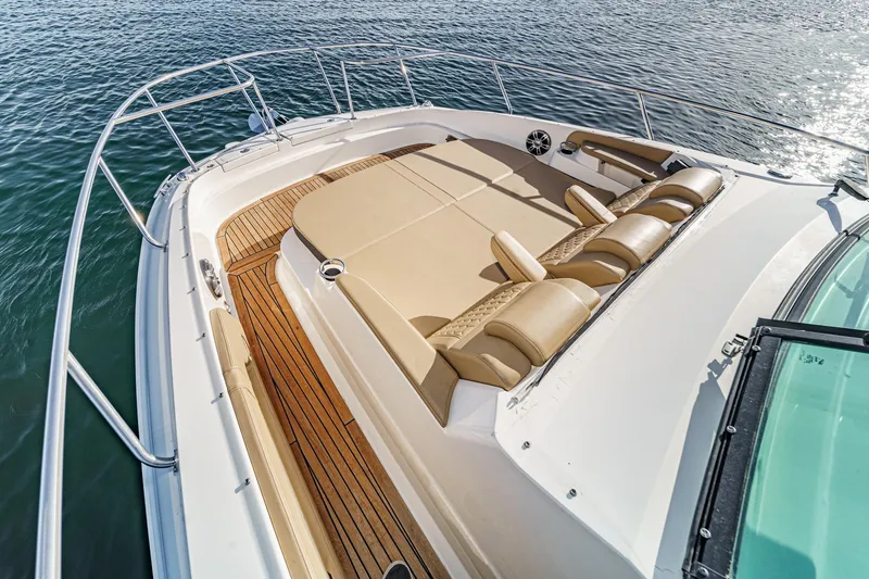 Slide: The Image of 2023 Sea Ray Sundancer 320 OB boat with spacious sun deck and luxurious seating. - 10