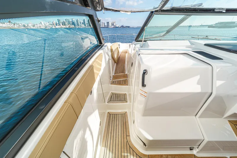 Slide: The Image of 2023 Sea Ray Sundancer 320 OB interior with sleek design and waterfront view. - 11