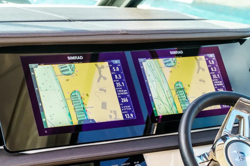 Slide: The Image of Dual navigation screens on 2023 Sea Ray Sundancer 320 OB boat dashboard. - 24