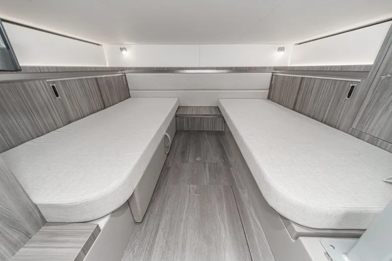 Slide: The Image of 2023 Sea Ray Sundancer 320 OB cabin interior with twin beds and modern design. - 36